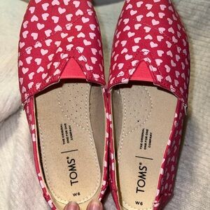 TOMS Pink and White Heart Pattern Slip-Ons